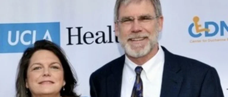 Drs. Carrie Miceli and Stan Nelson smiling at award event. 