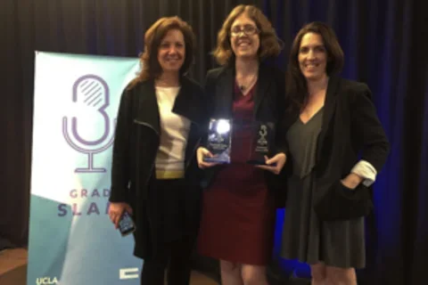 Courtney Young and two other female scientists stand with Grad Slam award for raising awareness about Duchenne muscular dystrophy.