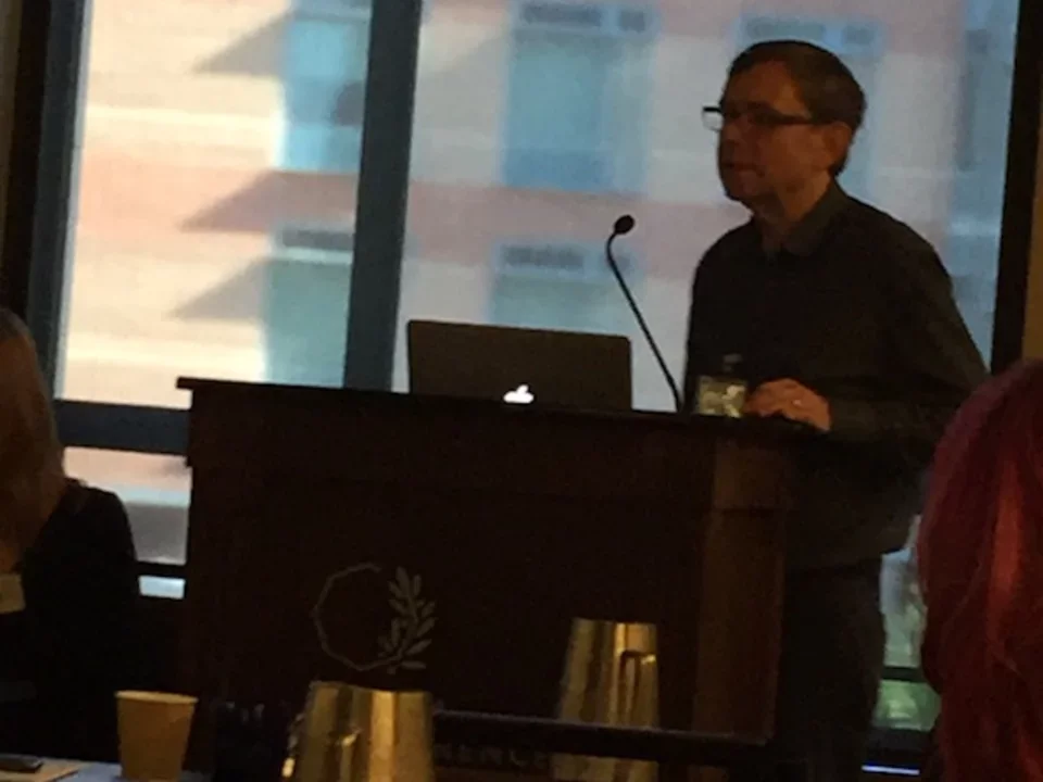 Man standing at podium during 2016 CDMD Retreat