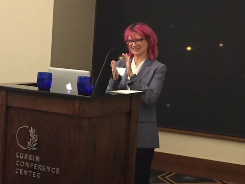 Dr. Rachelle Crosbie-Watson at podium of 2016 CDMD Retreat