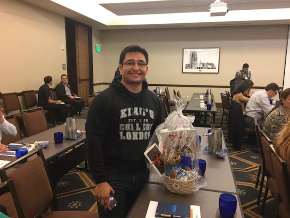 Man standing with gift basket at 2016 CDMD Retreat